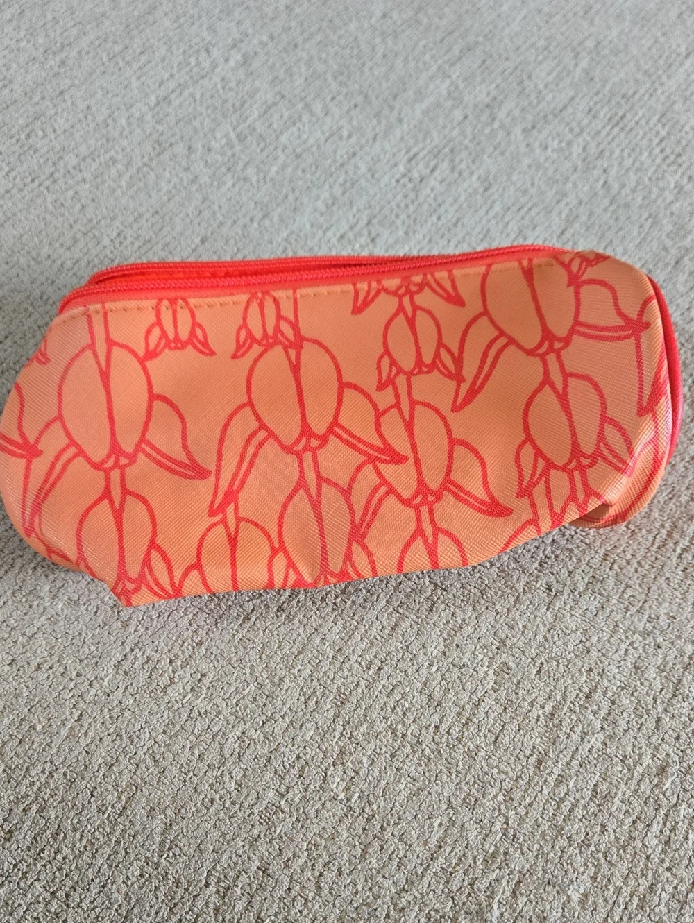 Manaola Orange Floral Print Cosmetic Bag with Coral Accents